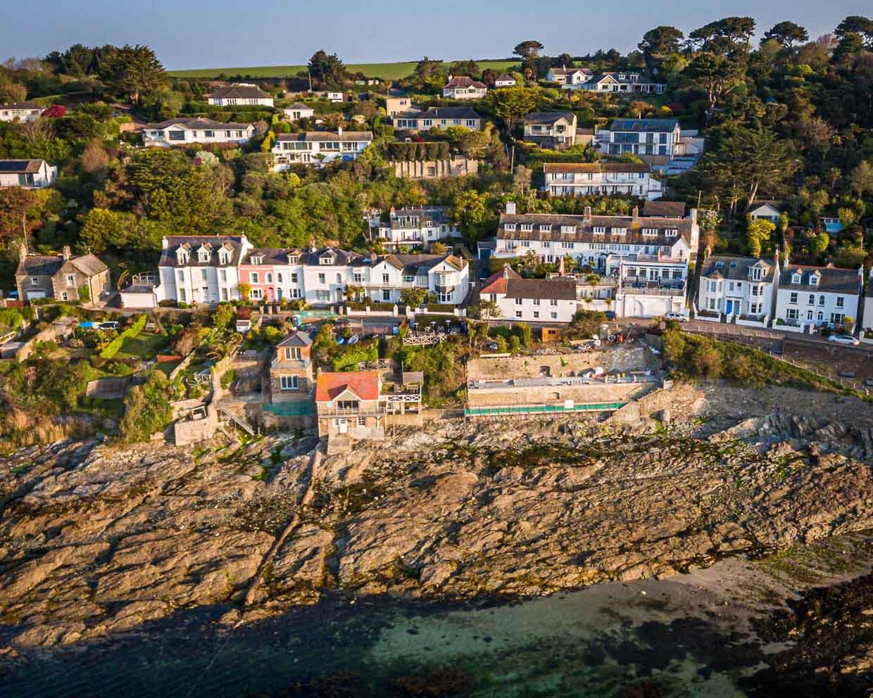 Aerial view of Tresanton with the buildings built into the hillside and the new beach club under construction / © Photo: Georg Berg