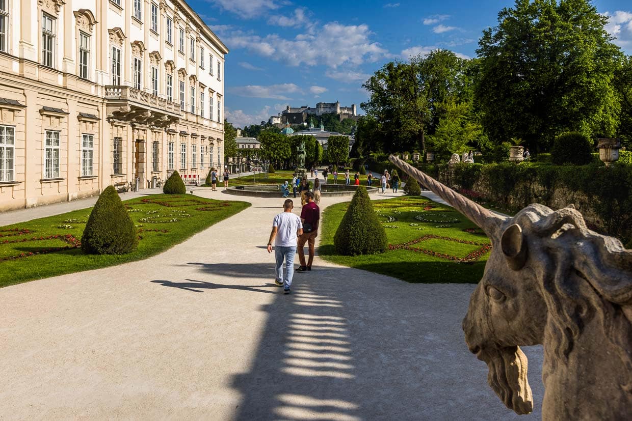 Mirabell Palace in Salzburg. Film tourists dance scenes from "The Sound of Music" on the stairs by the stone unicorn / © Photo: Georg Berg